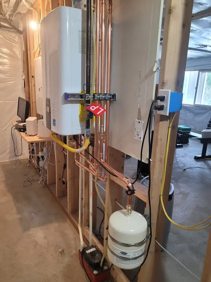 Licensed plumber repairing a kitchen sink in Tilden